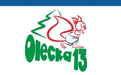 Plakat zapraszający do Olecka na kolejną edycję biegu Olecka Trzynastka. 