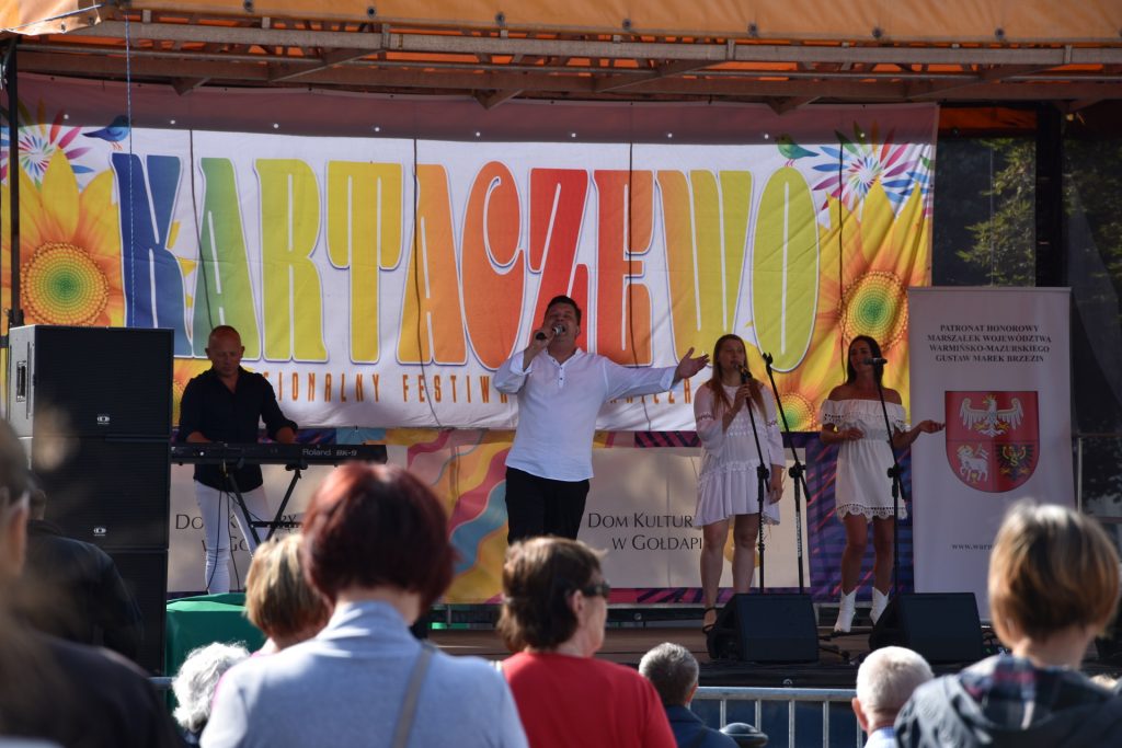 Zdjęcie zapraszające do Gołdapi na cykliczną imprezę Regionalny Festiwal Pogranicza Kartaczewo Gołdap. 