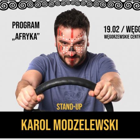 Plakat graficzny zapraszający do Węgorzewa na występ Stand-up Karol Modzelewski Węgorzewo 2022.