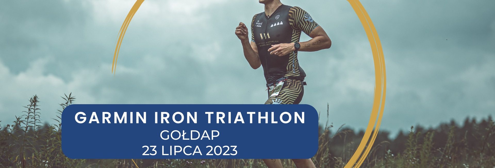 Plakat zapraszający do Gołdapi na 12. edycję imprezy sportowej Garmin Iron Triathlon Gołdap 2023.