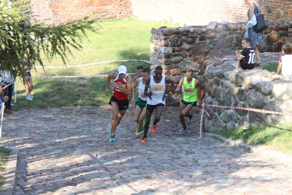 Zdjęcie zapraszające na kolejną edycję Biegu "Wokół Pasłęckich Murów Obronnych" Pasłęk.