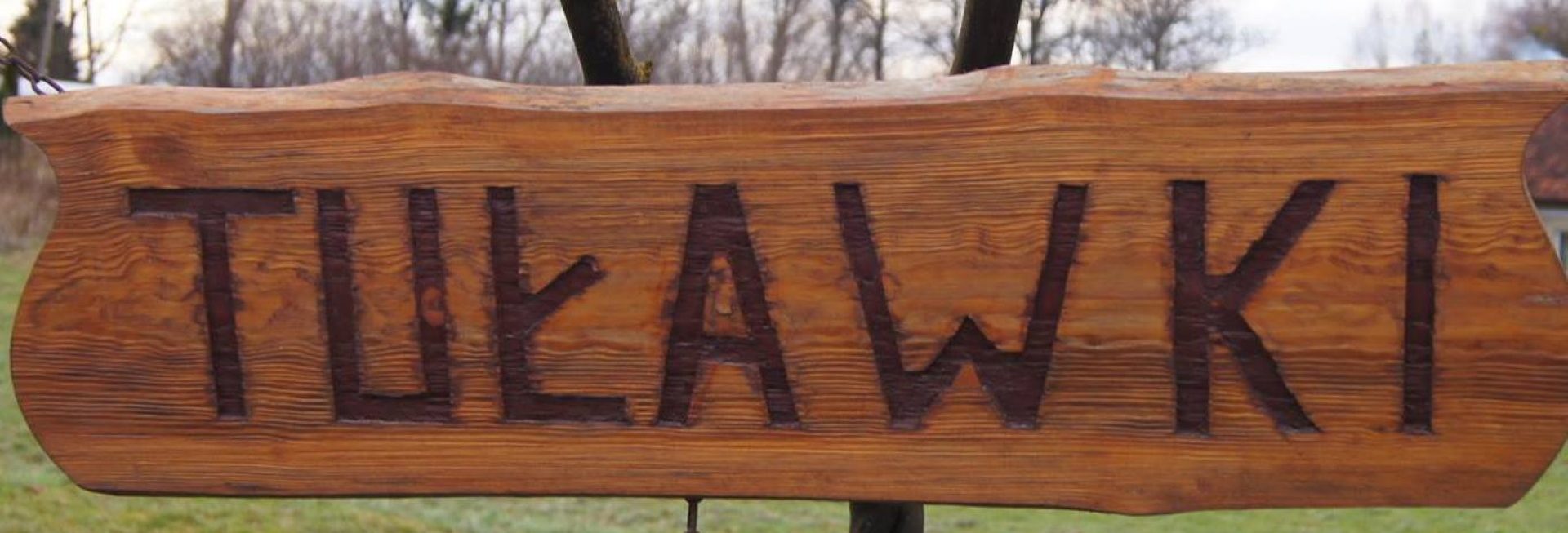 Zdjęcie zapraszające do miejscowości Tuławki w gminie Dywit koło Olsztyna.