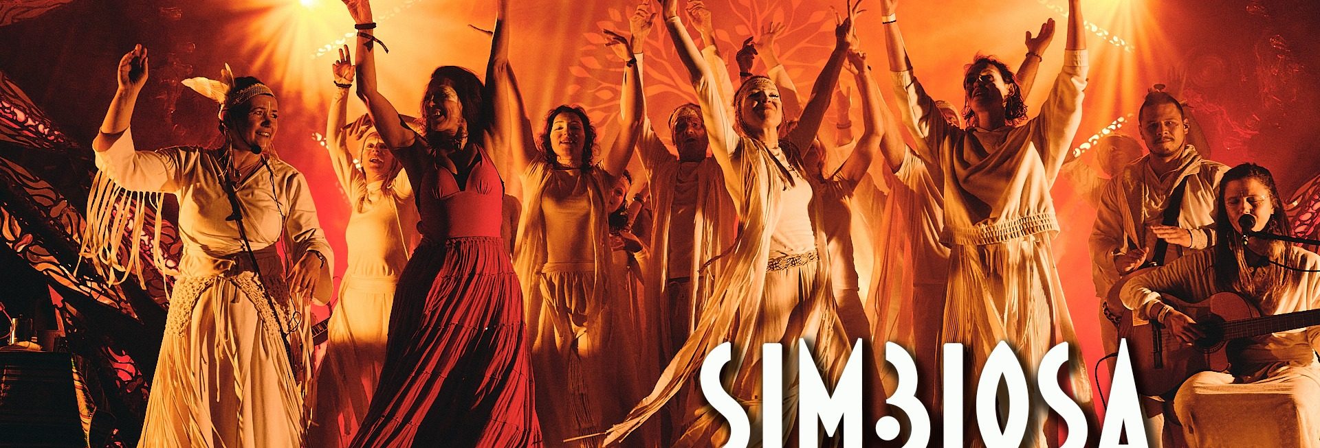 Plakat zapraszający w dniach 10-14 czerwca 2026 r. do miejscowości Warchały na kolejną edycję Festiwalu Simbiosa Warchały 2026.